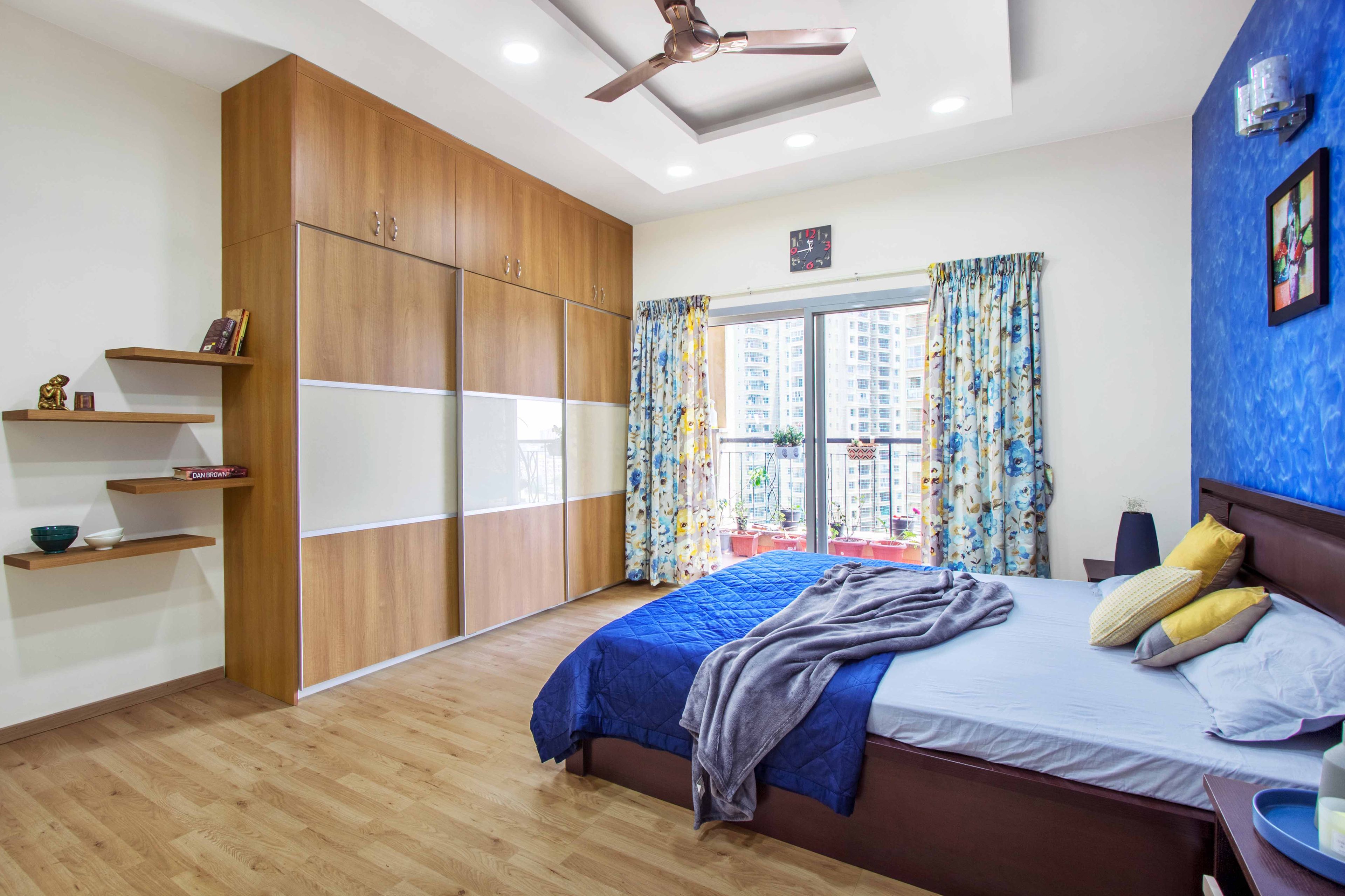 Master Bedroom Design With Textured Bright Blue Accent Wall - Livspace