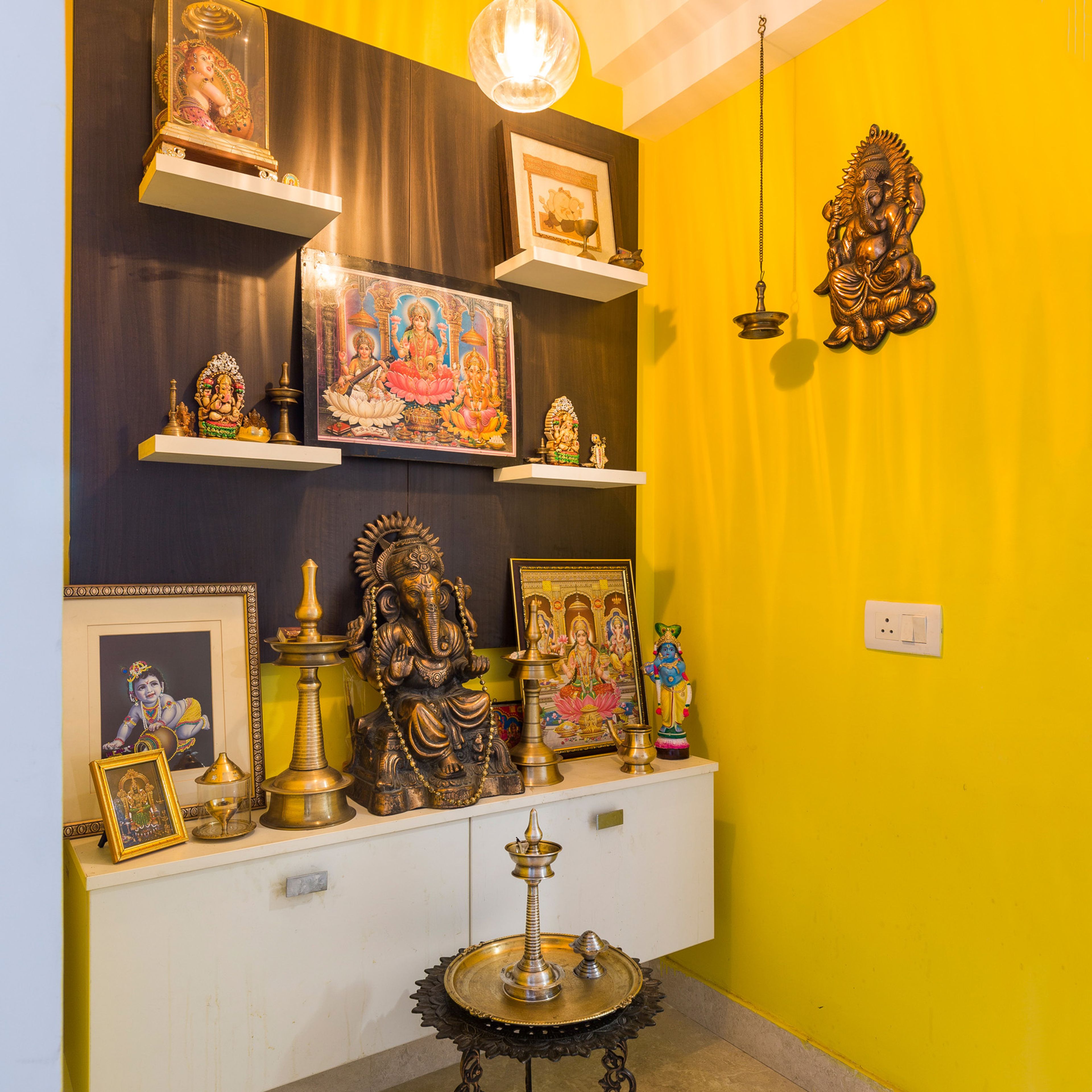 Modern Pooja Room Design With Metal Artwork