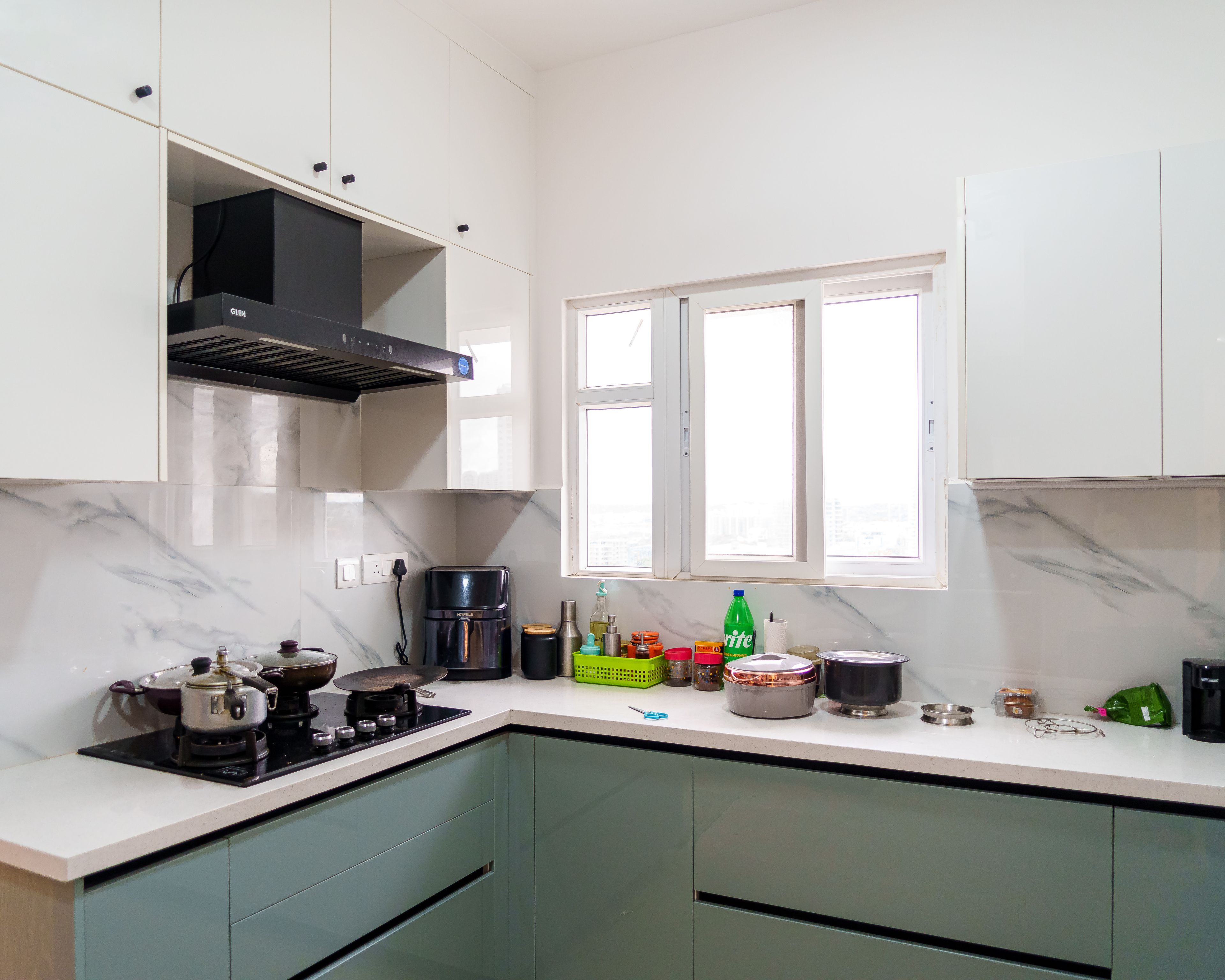 L-Shaped Modular Kitchen Design with Mint Green Cabinets