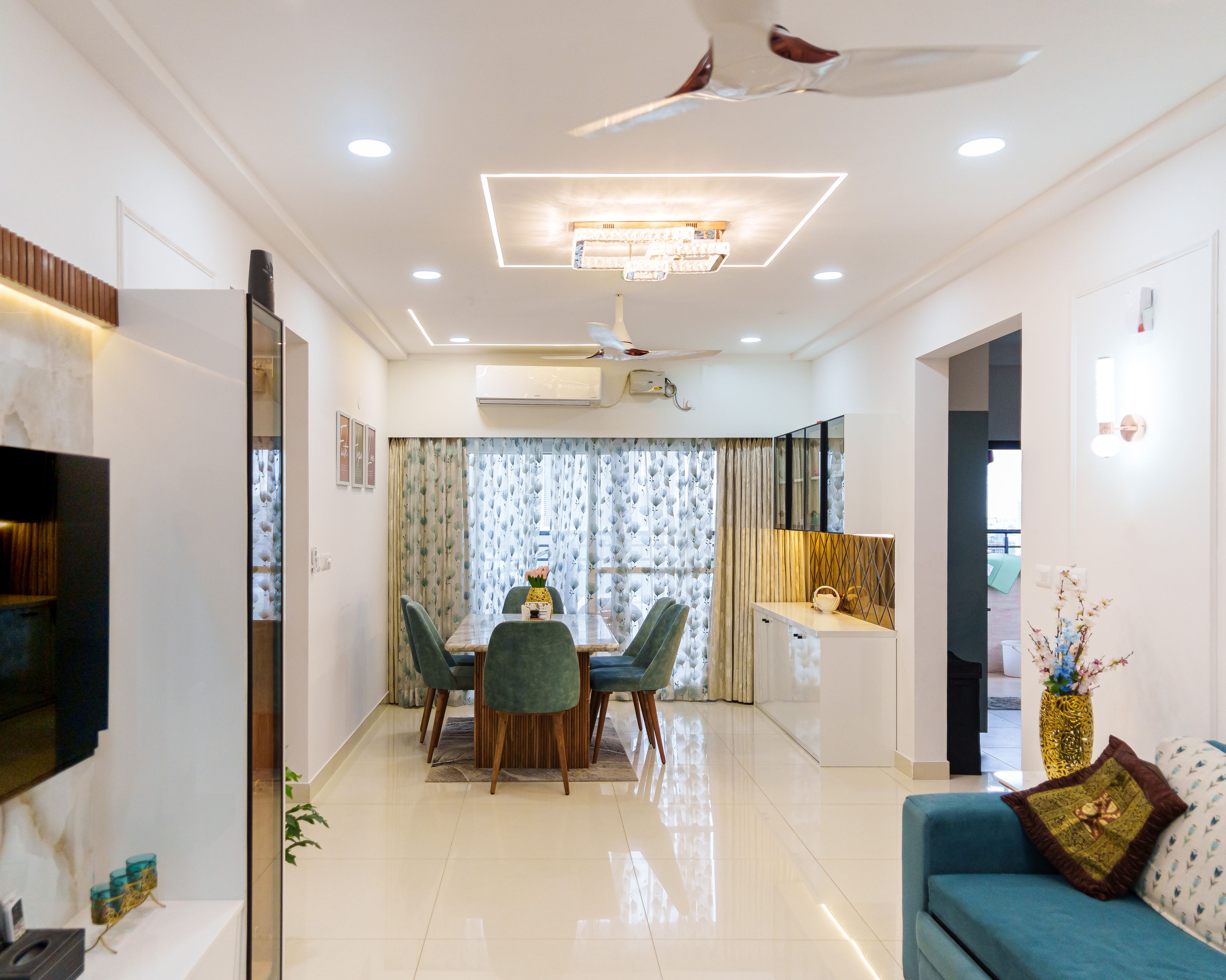 Living Cum Dining Room Design with Spot Light, Cove Light and Chandelier