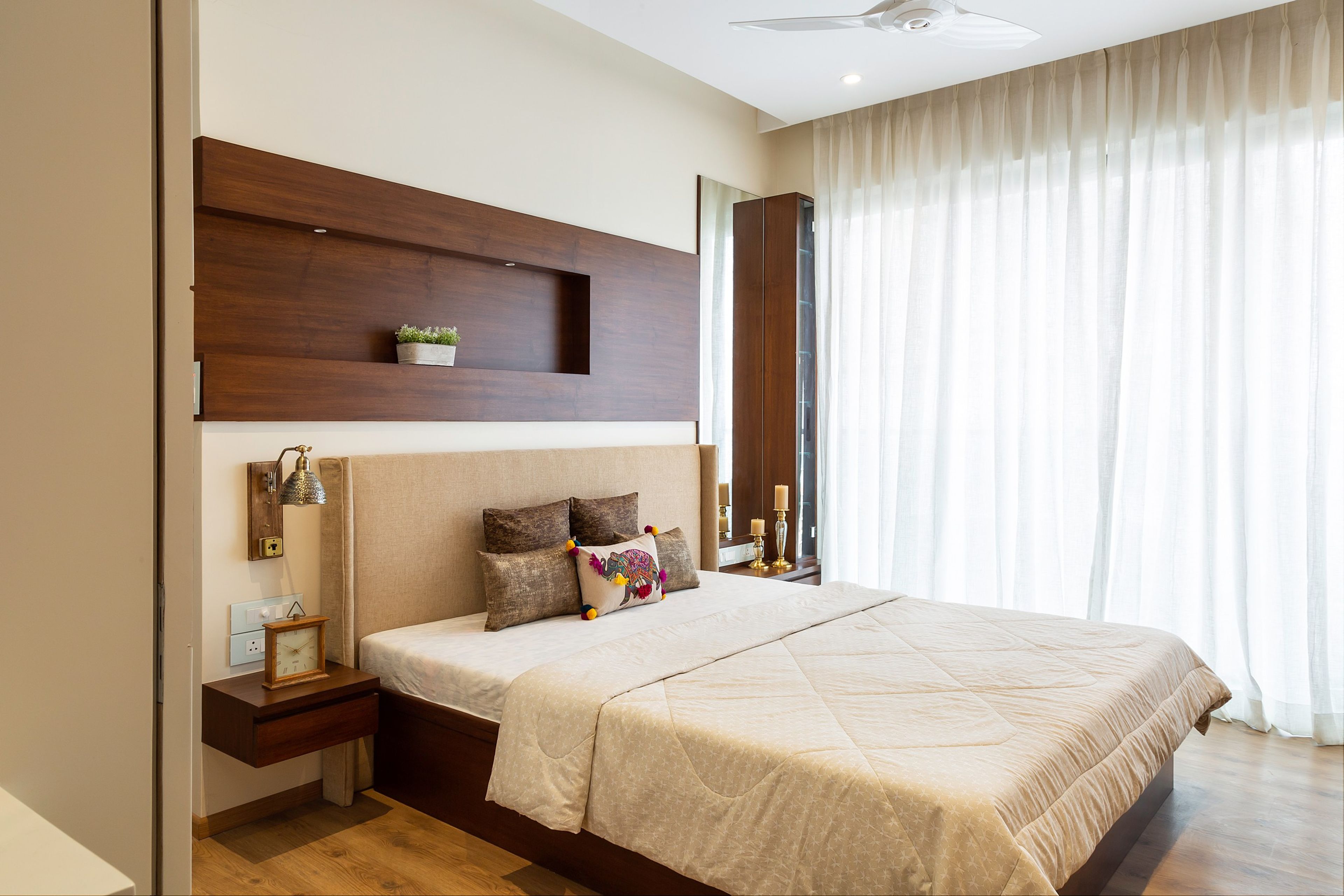 Master Bedroom Design With Double Bed And Wooden Wall-Mounted Drawers - Livspace