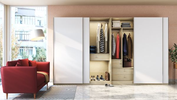 Wardrobe with sliding doors and red sofa