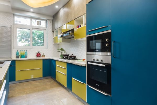 Spacious L-Shaped Kitchen Design With Tinted Aqua-Blue Cabinets