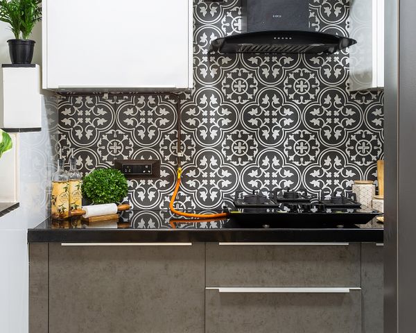 Stain-Resistant Kitchen Tile Design In Contrasting Shades | Livspace
