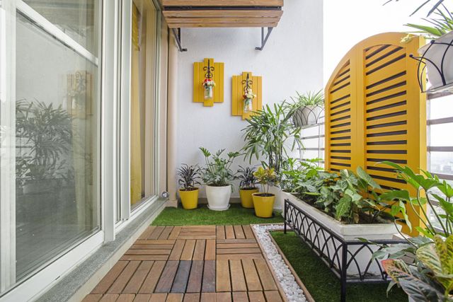 Noida Flat Interior Design with Inviting Wooden Balcony, Vibrant Living ...