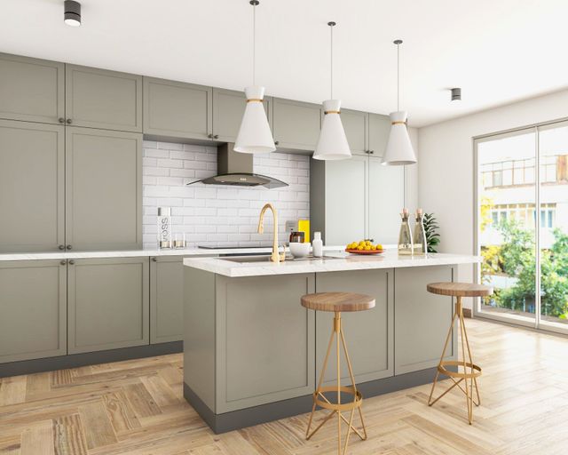 Modern River Stone Island Kitchen Design with Quartz Countertops | Livspace