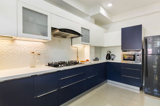 Champagne-Toned And Wave Blue U Shaped Kitchen Design | Livspace