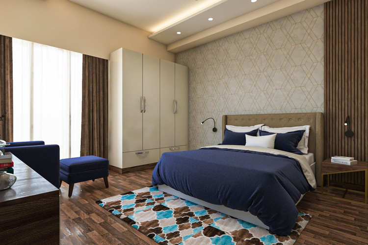 Spacious Master Bedroom Design With Blue Accent Chair | Livspace