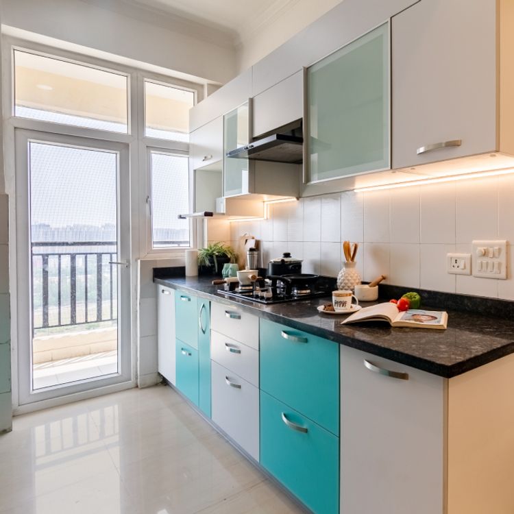 Compact Kitchen Design with Blue And White Storage Units | Livspace