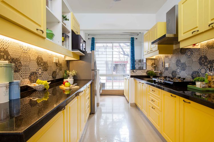 Modular Parallel Kitchen Design With Yellow Cabinets | Livspace