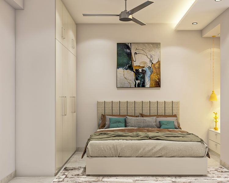 Guest Room Design With Beige Headboard And 4-Door Wardrobe | Livspace
