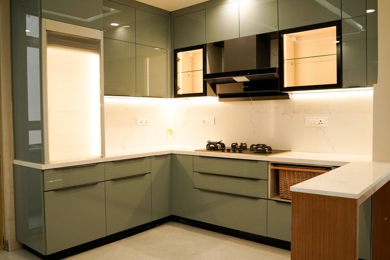 U-Shaped Kitchen Design with Green Units and White Countertop