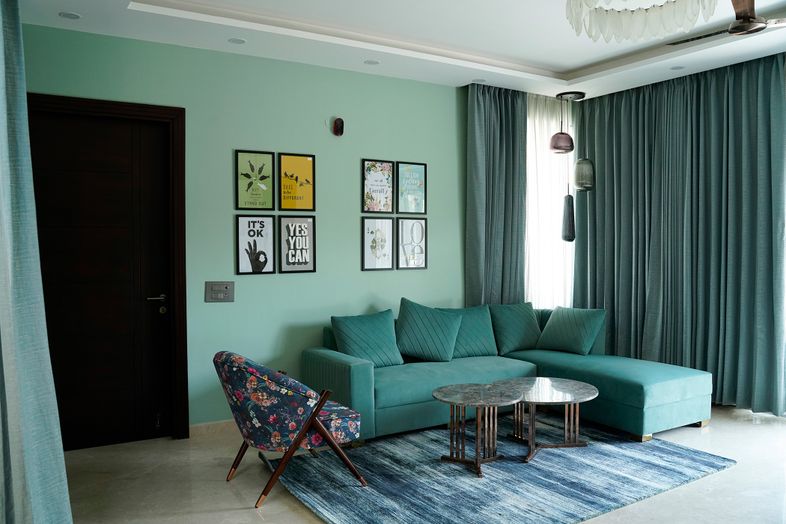 Living Room Design with Teal L-Shaped Sofa and Blue Accent Chair