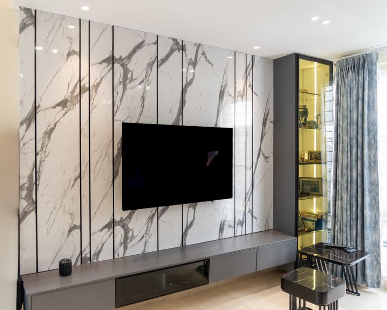 TV Unit Design with Marble Texture Wall Panels and Glass Display Cabinet