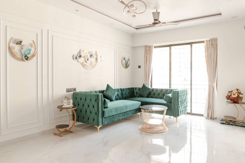 Living Room Design with Green L-Shaped Chesterfield Sofa and White Walls with Trims