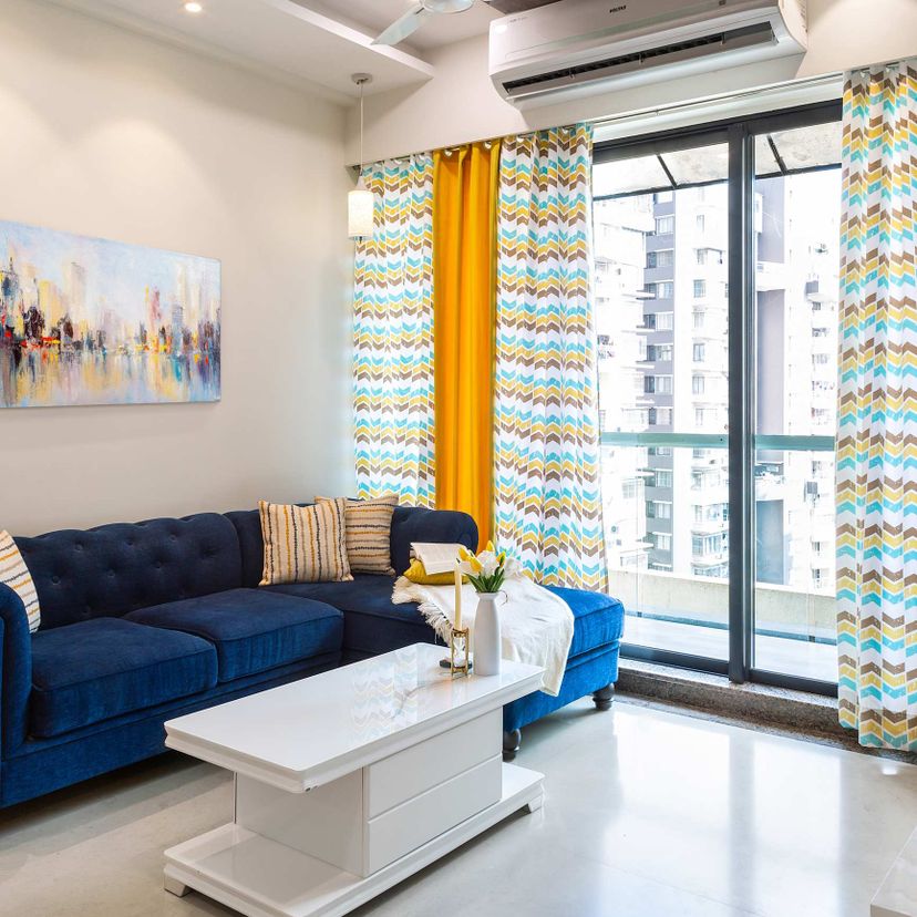 Living Room Tile Design With Bianco Beige Marble Tiles | Livspace