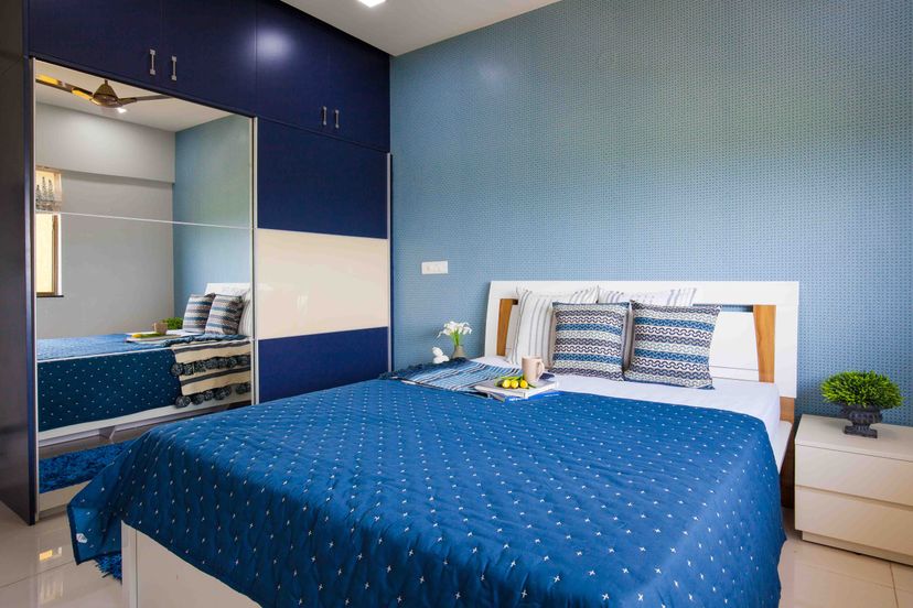 2-Door Blue And White Mirrored Sliding Wardrobe Design For Bedroom | Livspace