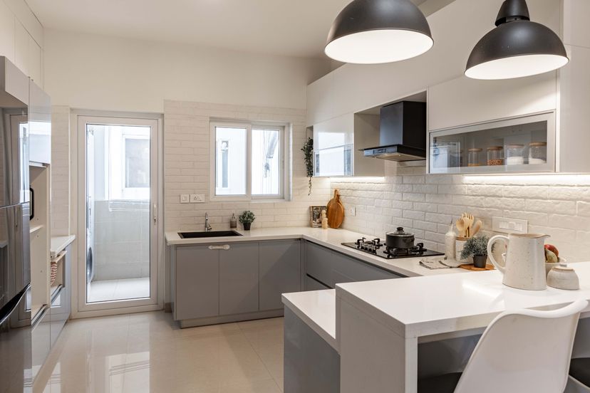Spacious Modular Kitchen Design With Grey And White Storage Cabinets ...