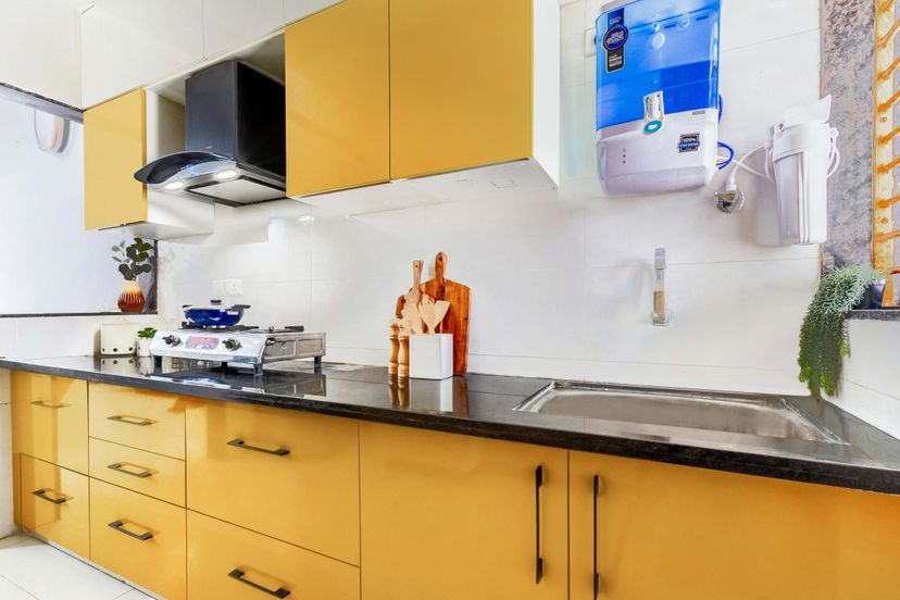Spacious Kitchen Design With A Tall Storage Unit | Livspace - Kitchen Designs For Apartments With A Large Kitchen Storage