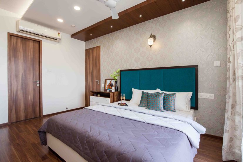 Master Bedroom Design With Beige Damask Wallpaper | Livspace