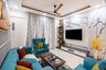 False Ceiling Design With Turquoise Couch - Livspace