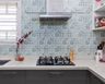 Kitchen Tile Design With Symmetric Leaf Patterns - Livspace