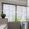 Bronze UPVC Window Design With Sliding Glass Shutters - Livspace