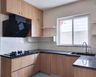 "U-Shaped Kitchen Design with Jet Black Granite Countertops U-Shaped Kitchen Design with Light Wood Cabinets"