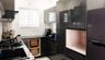 High Gloss U-Shaped Kitchen Design in Black With Marble Accents