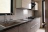 L-Shaped Kitchen Design With Grey Storage Cabinets