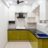 L-Shaped Design With Lime Cabinets and Granite Counter