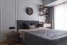 Master Bedroom Design with Statement Accent Wall and Hydraulic Bed
