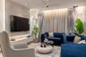 Blue Living Room Design With Floating TV and Marble Accents