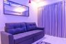 Purple Walls and Sleek Sofa Space Saving Design