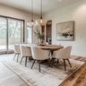 Dining Room Design With Upholstered Chairs and Wooden Table