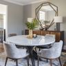 Dining Room Design with Marble Table and Upholstered Chairs