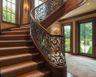 Ornate Classic Curved Staircase Design With Wrought Iron Detailing