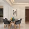Dining room design with black table, wooden chairs, and minimalist wall art