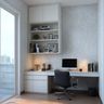 Home office with built-in desk, open shelving, and natural light from large window