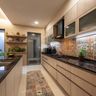 Island kitchen with patterned backsplash, central island, and frosted glass cabinets
