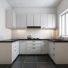 White U-shaped kitchen with black countertops and ceiling-height storage cabinets