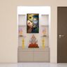 Pooja unit with Krishna-Radha painting, side idol shelves, and warm recessed lighting