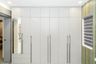 7-Door White Swing Wardrobe Design with Lofts