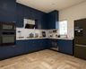 L-Shaped Kitchen Design with Dark Blue Cabinets and Quartz Counters