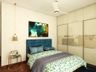 Contemporary Compact Master Bedroom - Livspace