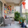 Eclectic Balcony Design with Abstract Painting and Sculptural Ceramic Snake Planters