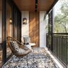 Balcony Design with Wood Panels and Rattan Chairs