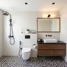 Modern Bathroom Design with Checkered Tiles and Warm Wooden Vanity Frame
