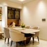 Dining Room Design with Quilted Chairs and Oval Dining Table