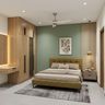 Guest Bedroom Design with Sage Accent Wall and Wardrobe